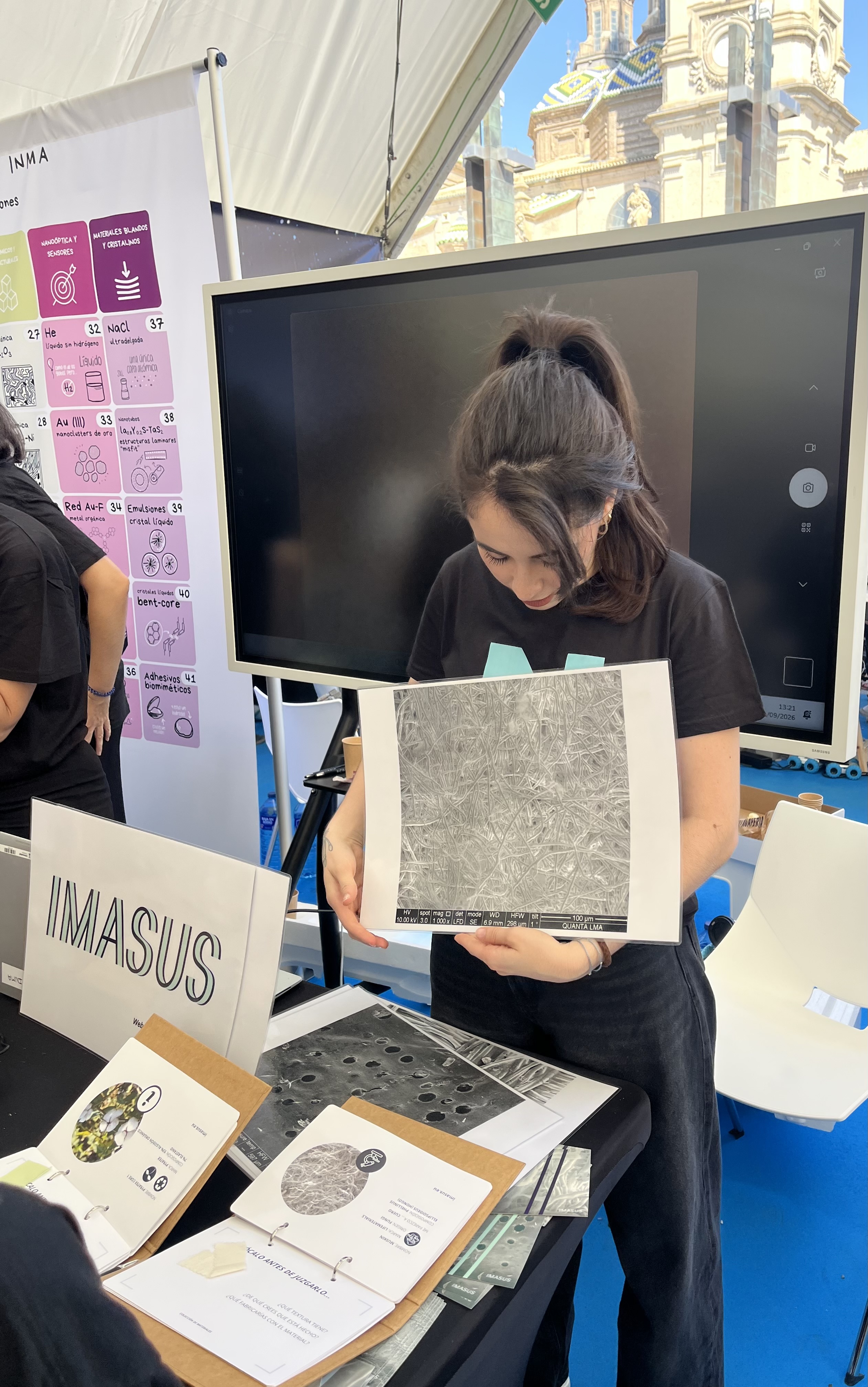 An IMASUS team member presenting material micrographs at the activity
